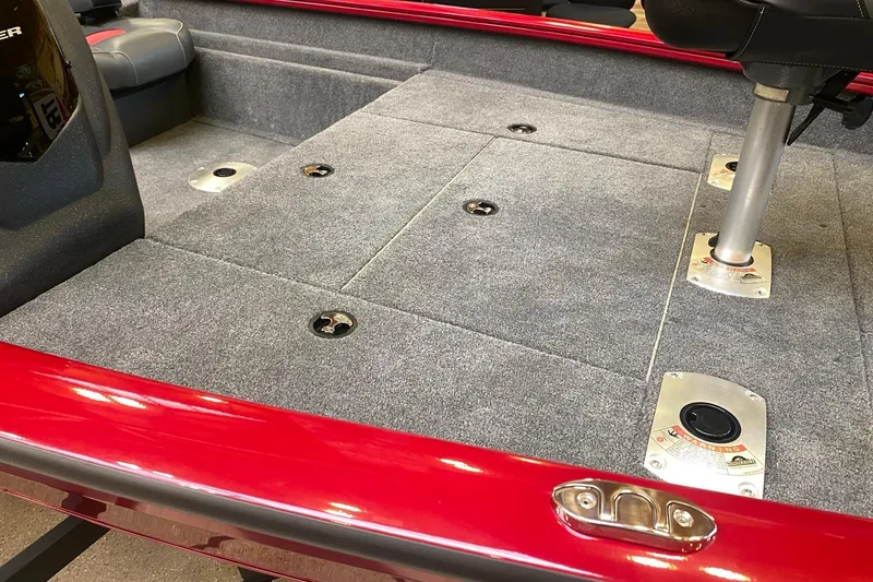 Slide: The Image of 2026 Tracker Pro Team 175 Crappie Edition boat interior with gray carpet and red trim. - 7