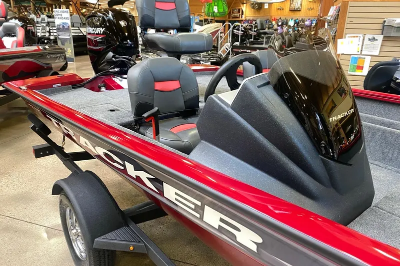 Slide: The Image of 2026 Tracker Pro Team 175 Crappie Edition boat, red and gray interior, showroom display. - 9