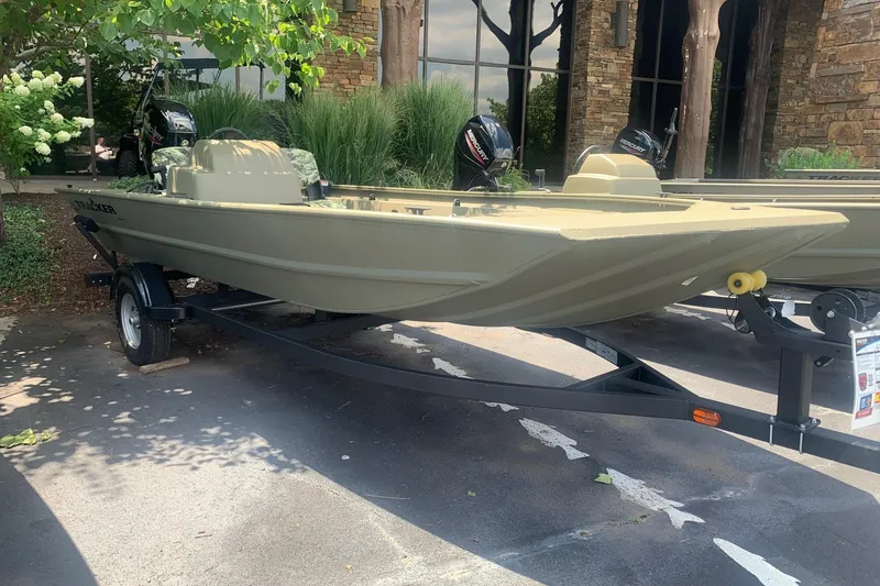 The Image of 2026 Tracker Grizzly 1754 SC boat on trailer, parked outdoors. - 0