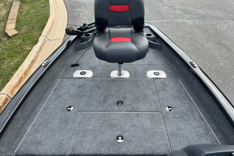 Slide: The Image of 2026 Tracker Pro Team 175 Crappie Edition boat interior with swivel seat and carpeted deck. - 3