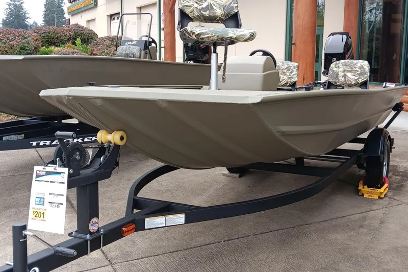 The Image of 2026 Tracker Grizzly 1754 SC boat on trailer, displayed outdoors. - 0