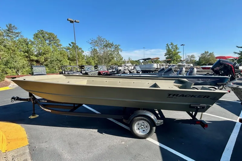 The Image of 2026 Tracker Grizzly 2072 Utility boat on trailer in parking lot. - 0