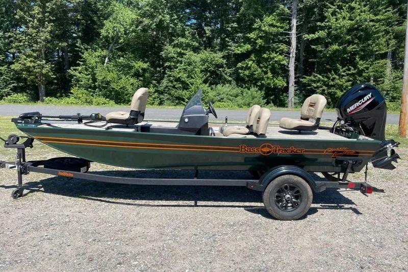 The Image of 2026 Tracker Bass Tracker Classic Limited boat on trailer, parked outdoors. - 0