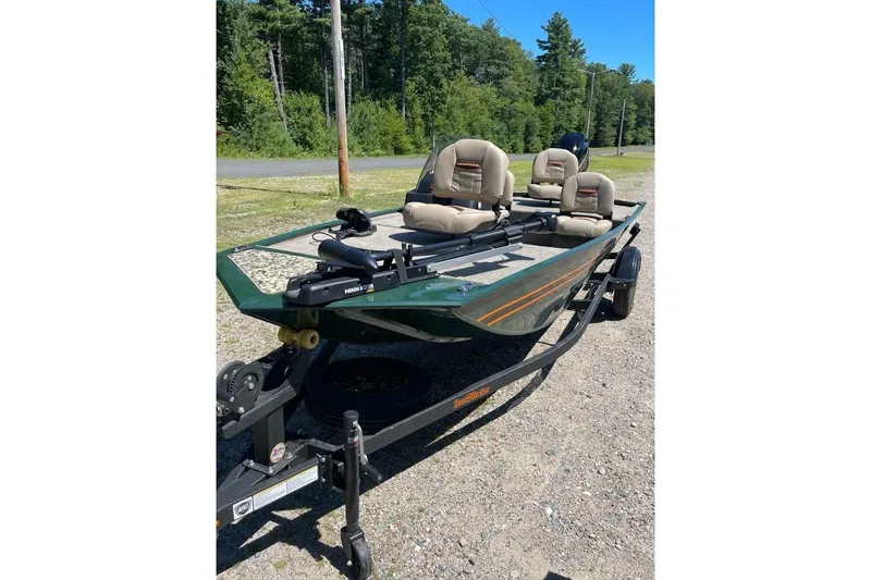 Slide: The Image of 2026 Tracker Bass Tracker Classic Limited boat on trailer, parked outdoors. - 2