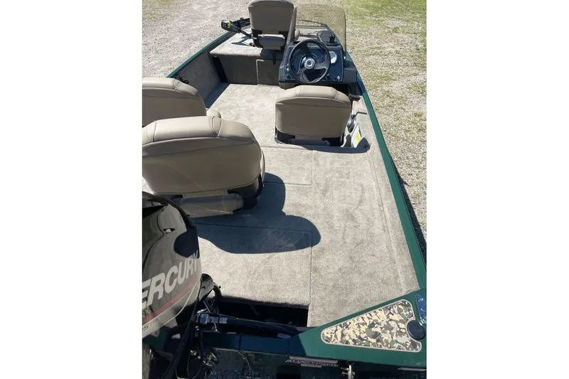 Slide: The Image of 2026 Tracker Bass Tracker Classic Limited boat interior with seating and steering console. - 3