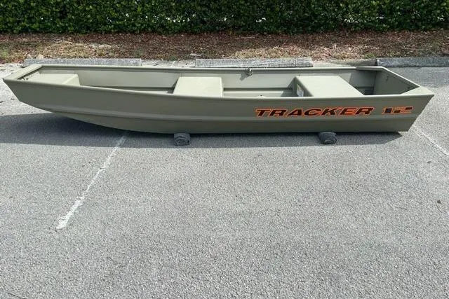 The Image of 2026 Tracker Grizzly 12 Jon boat in a parking lot. - 0
