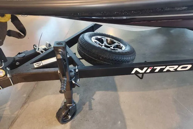 Slide: The Image of 2026 Nitro Z20 XL Pro trailer with spare tire and jack on display. - 7