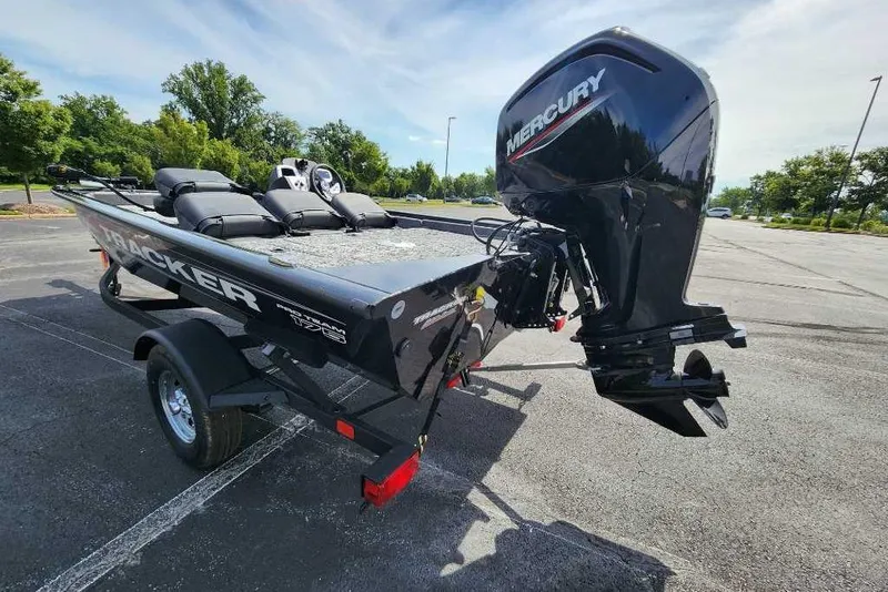 Slide: The Image of 2026 Tracker Pro Team 175 Crappie Edition boat with Mercury engine in parking lot. - 3