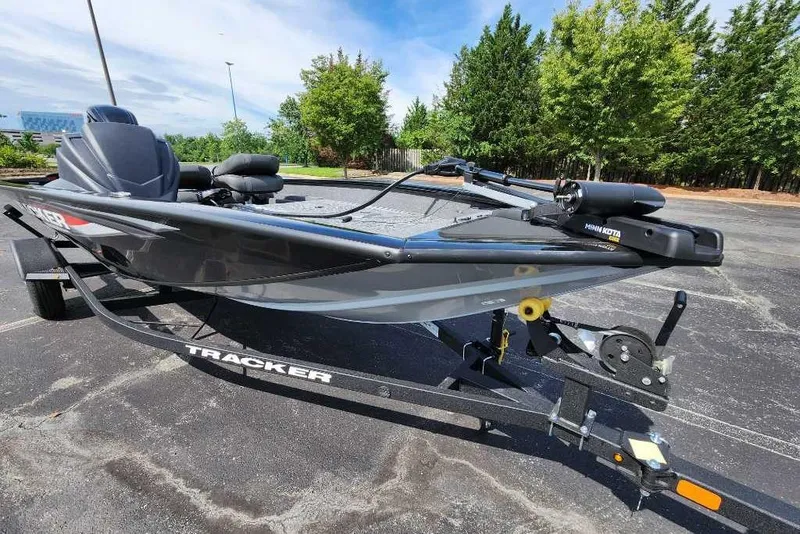 Slide: The Image of 2026 Tracker Pro Team 175 Crappie Edition boat on trailer, parked outdoors. - 6