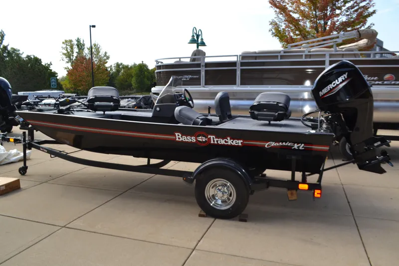 The Image of 2026 Tracker Bass Tracker Classic XL boat with Mercury engine on a trailer. - 0