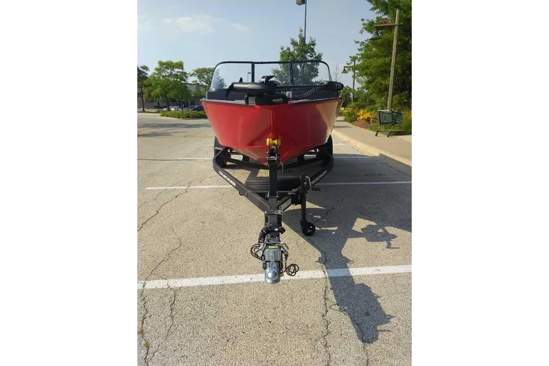 Slide: The Image of 2026 Tracker Pro Guide V-175 WT boat on trailer in parking lot. - 2