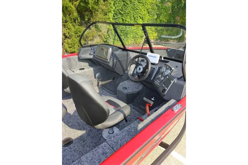 Slide: The Image of Interior of 2026 Tracker Pro Guide V-175 WT boat with steering and dashboard. - 96