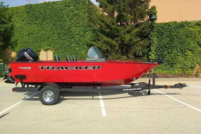 Slide: The Image of 2026 Tracker Pro Guide V-175 WT boat in vibrant red on a trailer. - 98