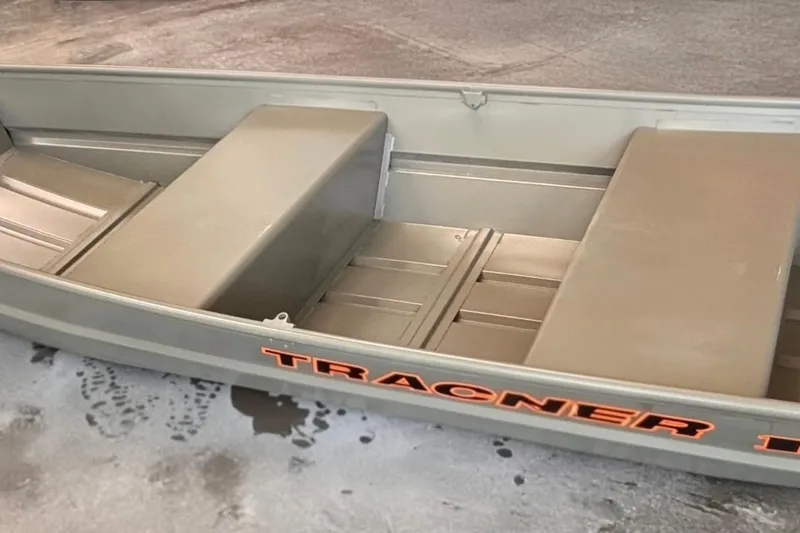 The Image of 2026 Tracker Grizzly 12 Jon boat, interior view, showcasing seating and storage. - 0