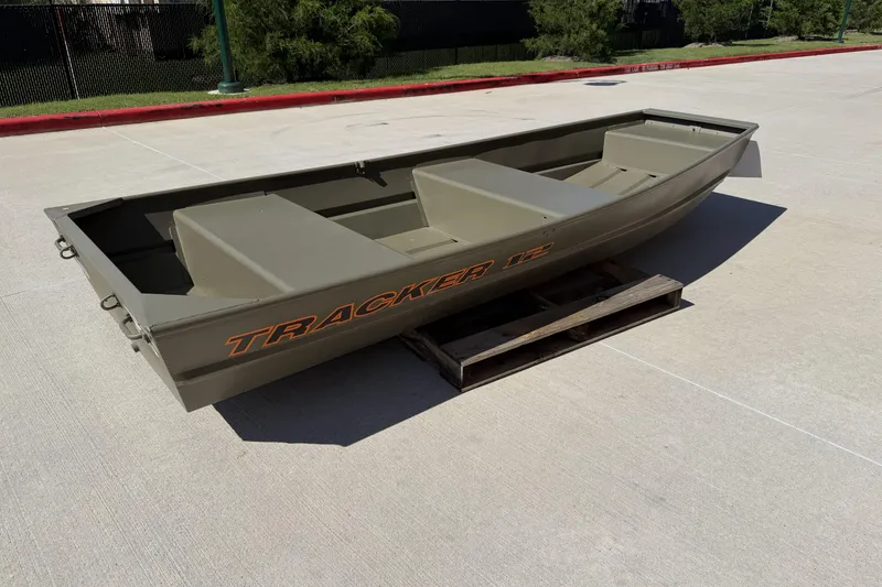 The Image of 2026 Tracker Grizzly 12 Jon boat on a wooden pallet outdoors. - 0