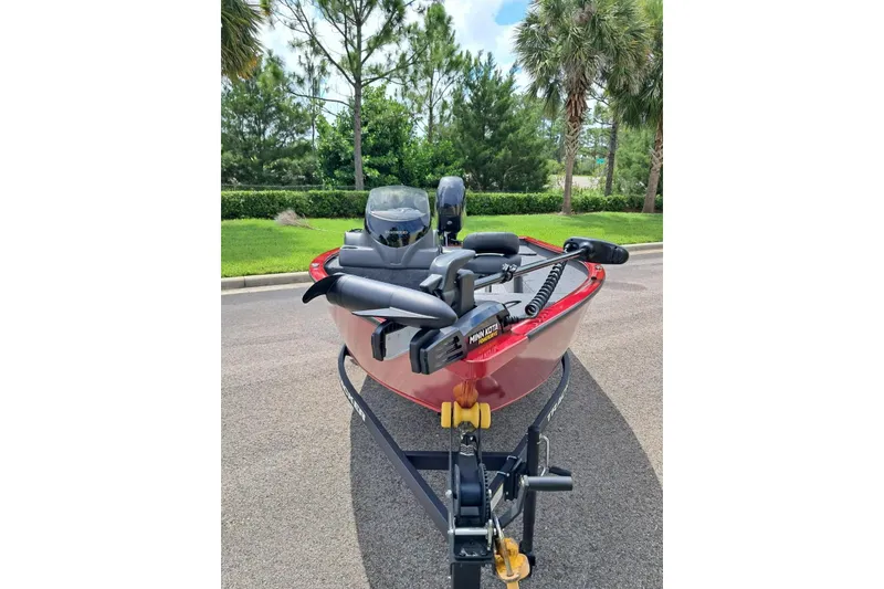 Slide: The Image of 2026 Tracker Super Guide V-16 SC boat on trailer, parked on a sunny day. - 3
