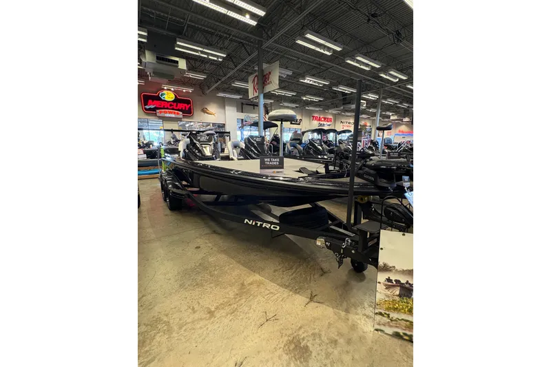 Slide: The Image of 2026 Nitro Z20 XL Pro boat displayed in a showroom with Mercury signage. - 2