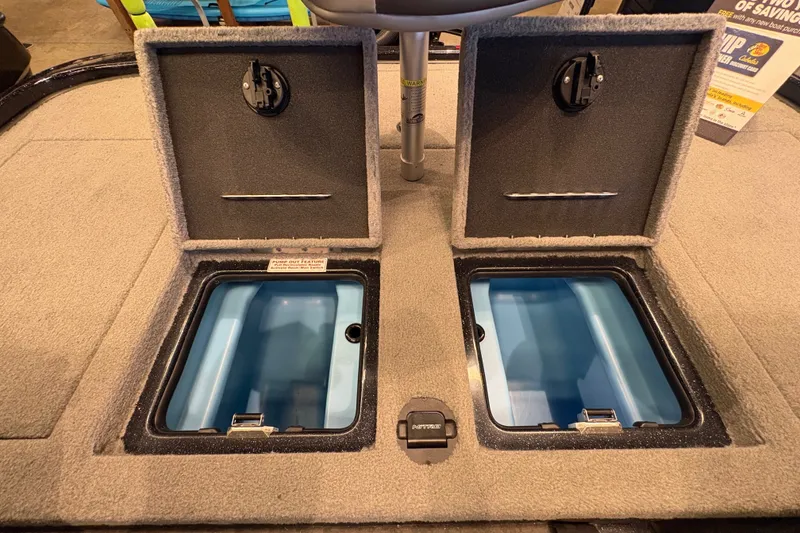 Slide: The Image of The image shows two open storage compartments on a boat, with blue interiors and gray carpeting. - 8