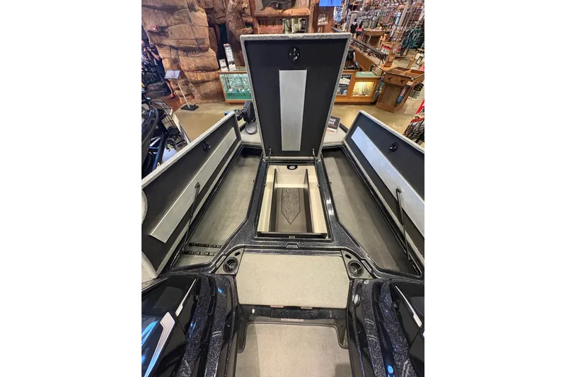 Slide: The Image of 2026 Nitro Z20 XL Pro boat interior with open storage compartments in showroom. - 6