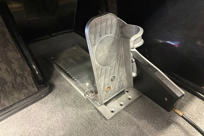 Slide: The Image of Foot pedal mechanism in a 2026 Nitro Z20 XL Pro boat interior. - 13