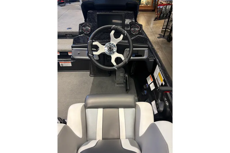 Slide: The Image of Interior view of 2026 Nitro Z20 XL Pro boat cockpit with steering wheel and controls. - 12