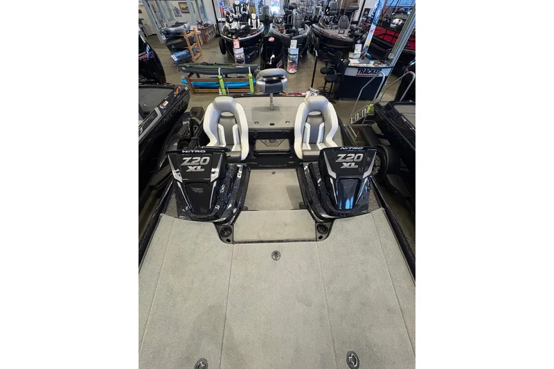 Slide: The Image of 2026 Nitro Z20 XL Pro boat interior with dual seats and sleek design. - 4