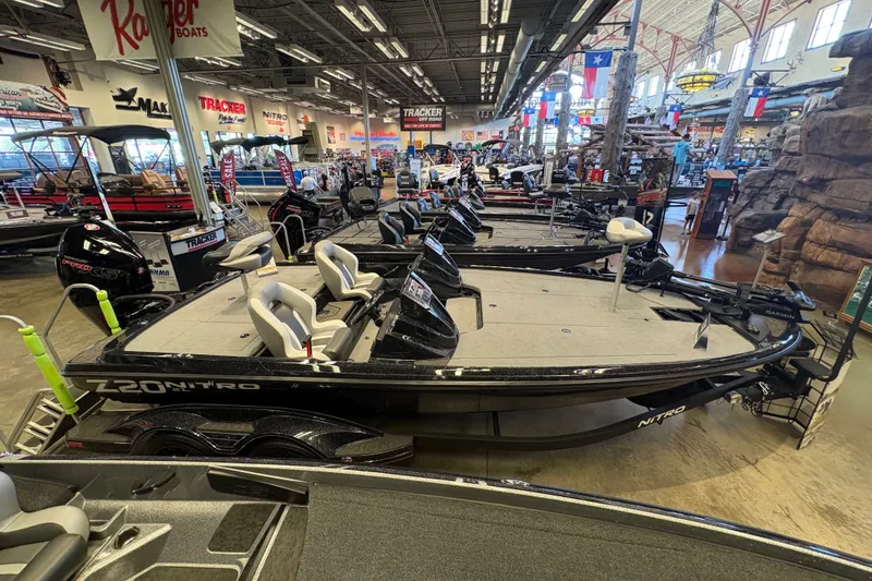 Slide: The Image of 2026 Nitro Z20 XL Pro boat displayed in a showroom with other models. - 3