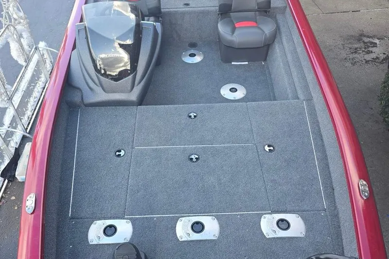 Slide: The Image of 2026 Tracker Pro Team 175 Crappie Edition boat interior with gray carpet and seating. - 3