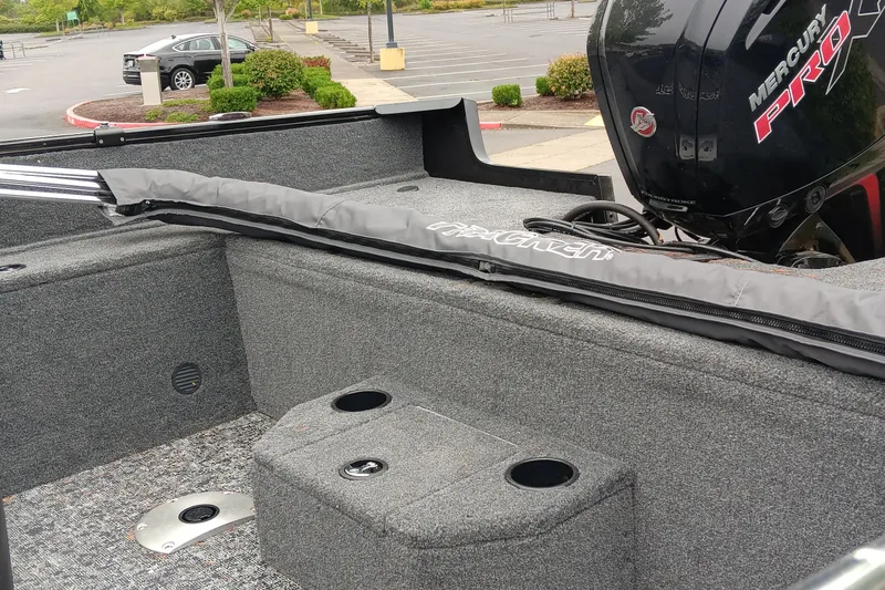 Slide: The Image of 2026 Tracker Pro Guide V-175 WT boat interior with Mercury Pro motor in parking lot. - 5