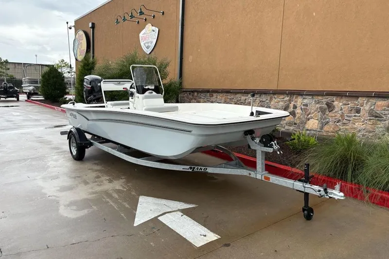 Slide: The Image of 2026 Mako Pro Skiff 17 CC boat on trailer, parked outdoors. - 3