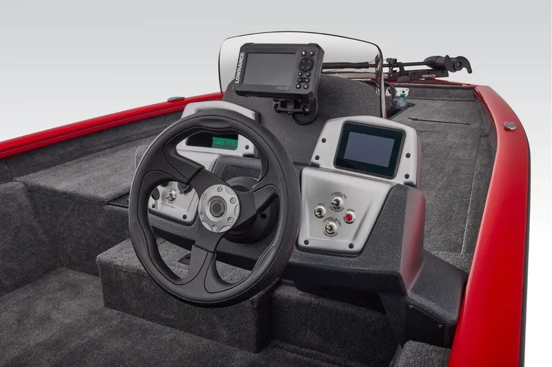 Slide: The Image of 2026 Tracker Pro Team 190 boat dashboard with steering wheel and electronic displays. - 10