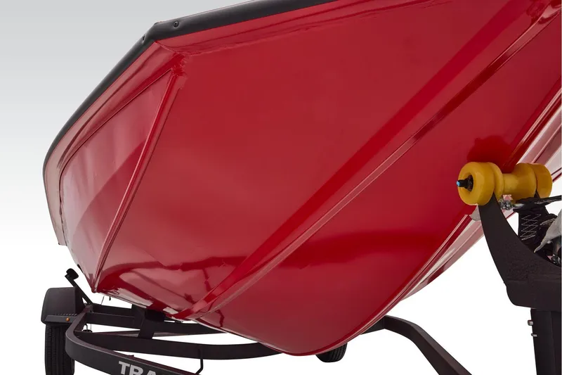 Slide: The Image of 2026 Tracker Pro Team 190 boat, red hull, on trailer, close-up view. - 4