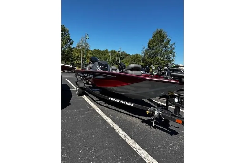 The Image of 2026 Tracker Pro Team 175 boat on trailer in parking lot. - 0