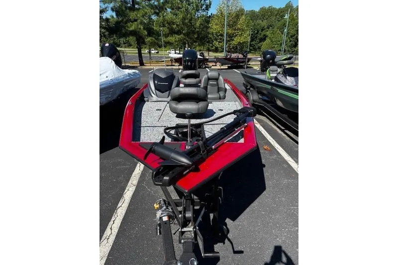 Slide: The Image of 2026 Tracker Pro Team 175 boat in parking lot, featuring red and gray design. - 2