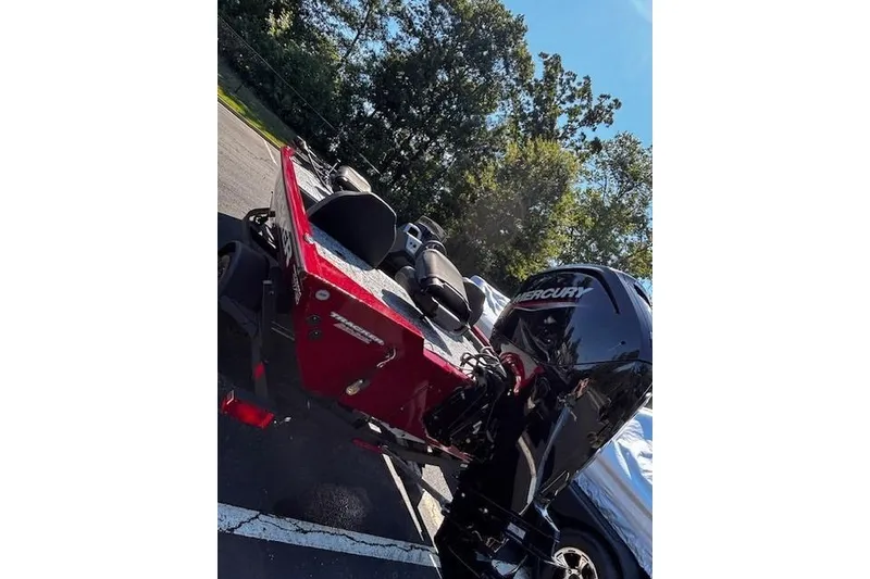 Slide: The Image of 2026 Tracker Pro Team 175 boat with Mercury engine, parked outdoors. - 3