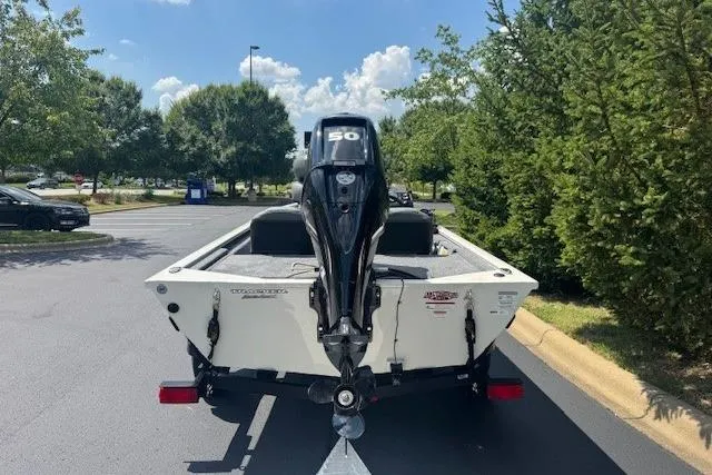 Slide: The Image of 2026 Tracker Pro 170 boat with 50 HP motor on a trailer in a parking lot. - 5