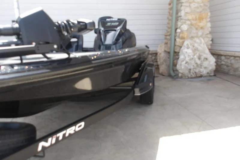 Slide: The Image of 2026 Nitro Z18 Pro boat parked on concrete near stone wall. - 4