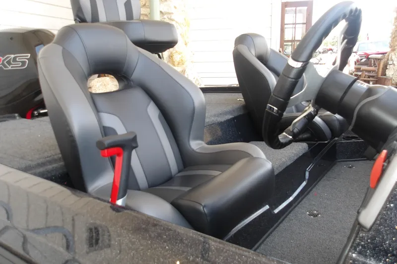 Slide: The Image of Interior of 2026 Nitro Z18 Pro boat with sleek black and gray seating. - 15