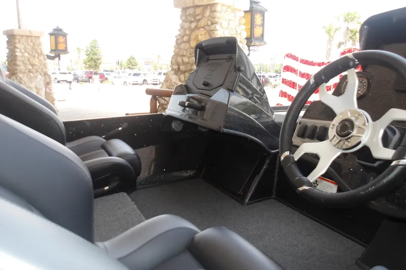 Slide: The Image of Interior of a 2026 Nitro Z18 Pro boat with modern steering and seating. - 14
