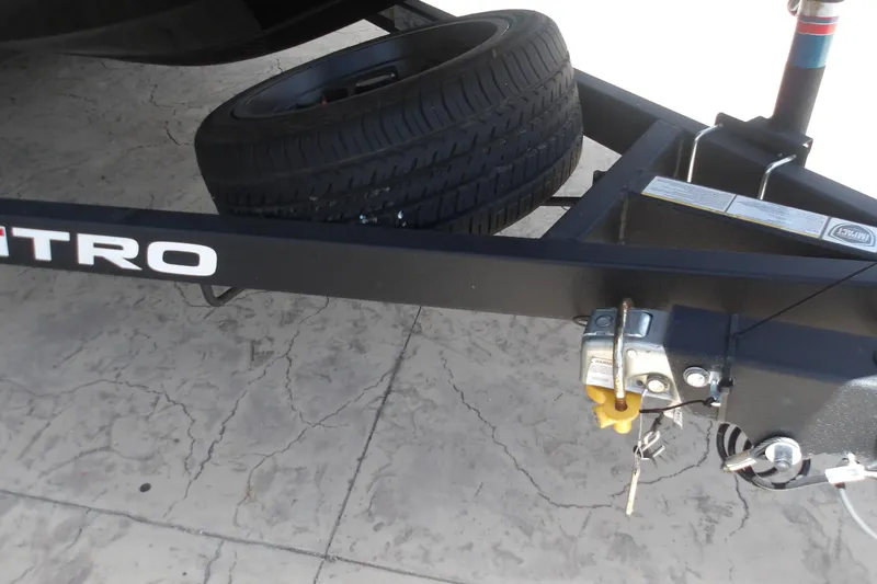 Slide: The Image of Trailer hitch and spare tire on a 2026 Nitro Z18 Pro boat trailer. - 20