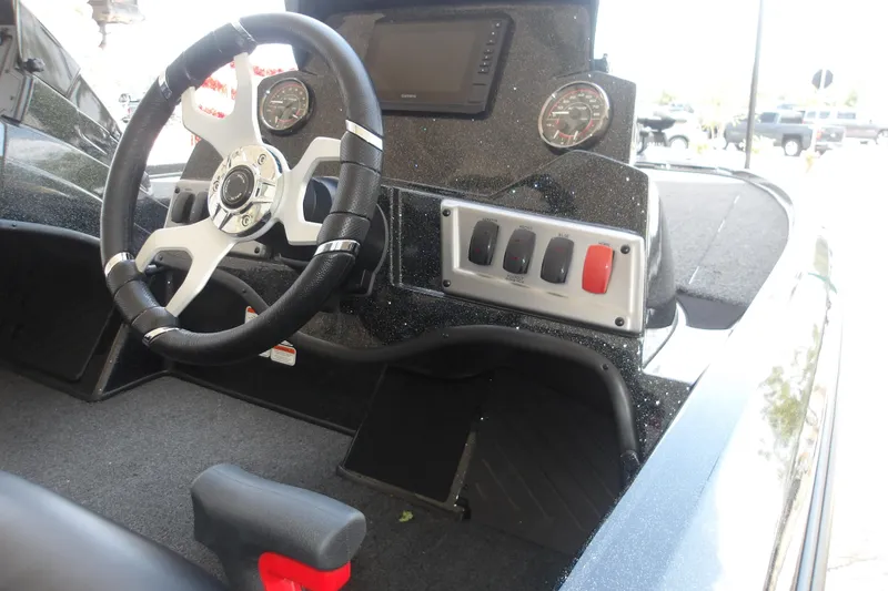 Slide: The Image of Steering console of 2026 Nitro Z18 Pro boat with gauges and control switches. - 13