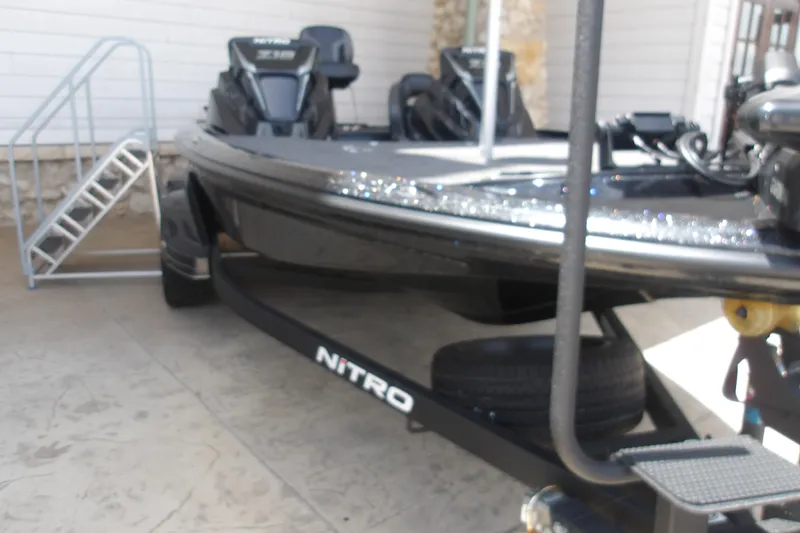 The Image of 2026 Nitro Z18 Pro boat on trailer, parked outdoors near a building. - 1