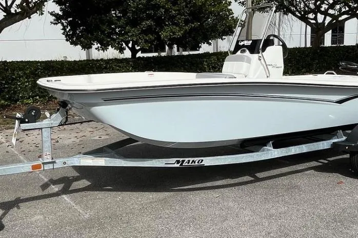 Slide: The Image of 2026 Mako Pro Skiff 15 CC boat on trailer, parked outdoors. - 9
