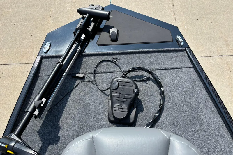 Slide: The Image of 2026 Tracker Bass Tracker Classic XL boat deck with trolling motor and foot pedal. - 3