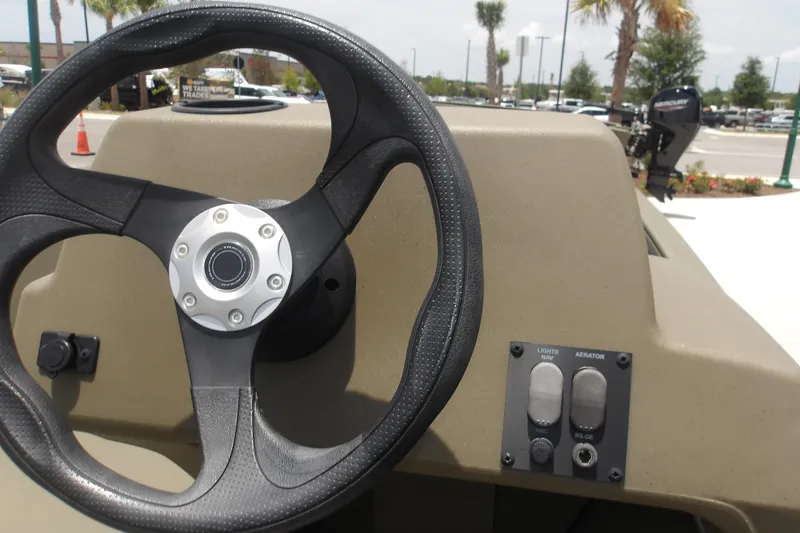 Slide: The Image of Steering wheel and controls of 2026 Tracker Grizzly 1648 SC boat. - 10
