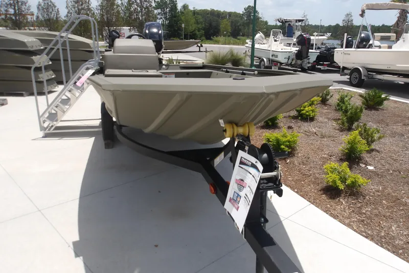 The Image of 2026 Tracker Grizzly 1648 SC boat on trailer, displayed outdoors. - 1