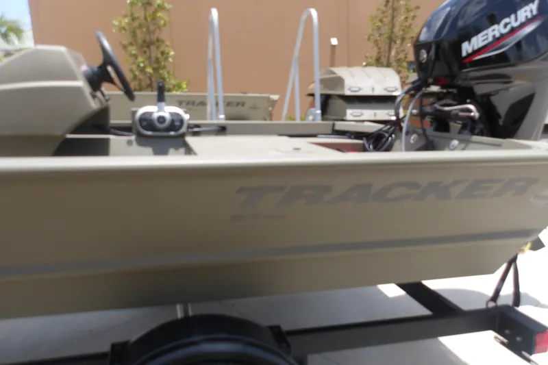 Slide: The Image of 2026 Tracker Grizzly 1648 SC boat with Mercury engine on trailer. - 4