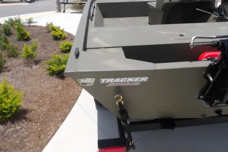 Slide: The Image of 2026 Tracker Grizzly 1648 SC boat displayed outdoors, showcasing its sturdy design. - 7
