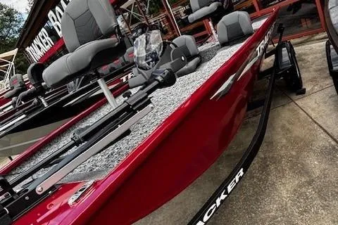 Slide: The Image of 2026 Tracker Pro 170 boat, red exterior, displayed at dealership. - 3