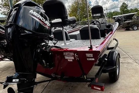 Slide: The Image of 2026 Tracker Pro 170 boat with Mercury engine, parked outdoors on a sunny day. - 4